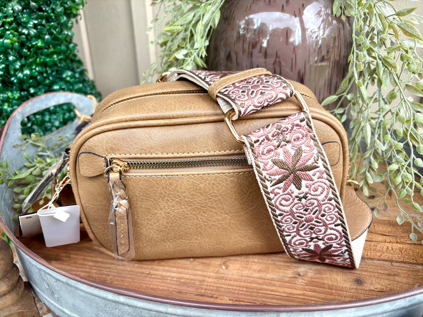 “Brown crossbody with adjustable guitar strap”