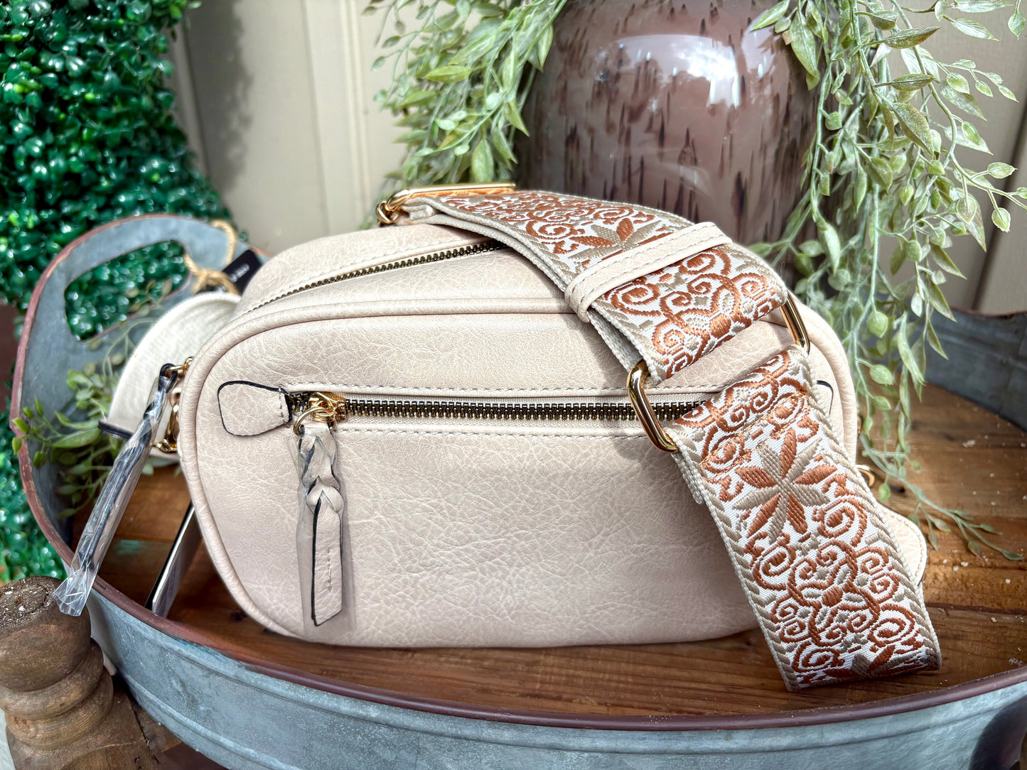 “Beige crossbody with adjustable guitar strap”
