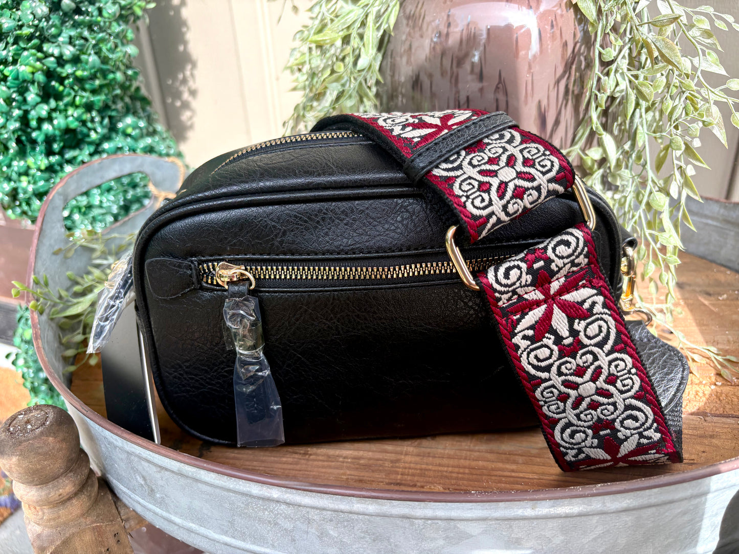 “Black crossbody with adjustable guitar strap”
